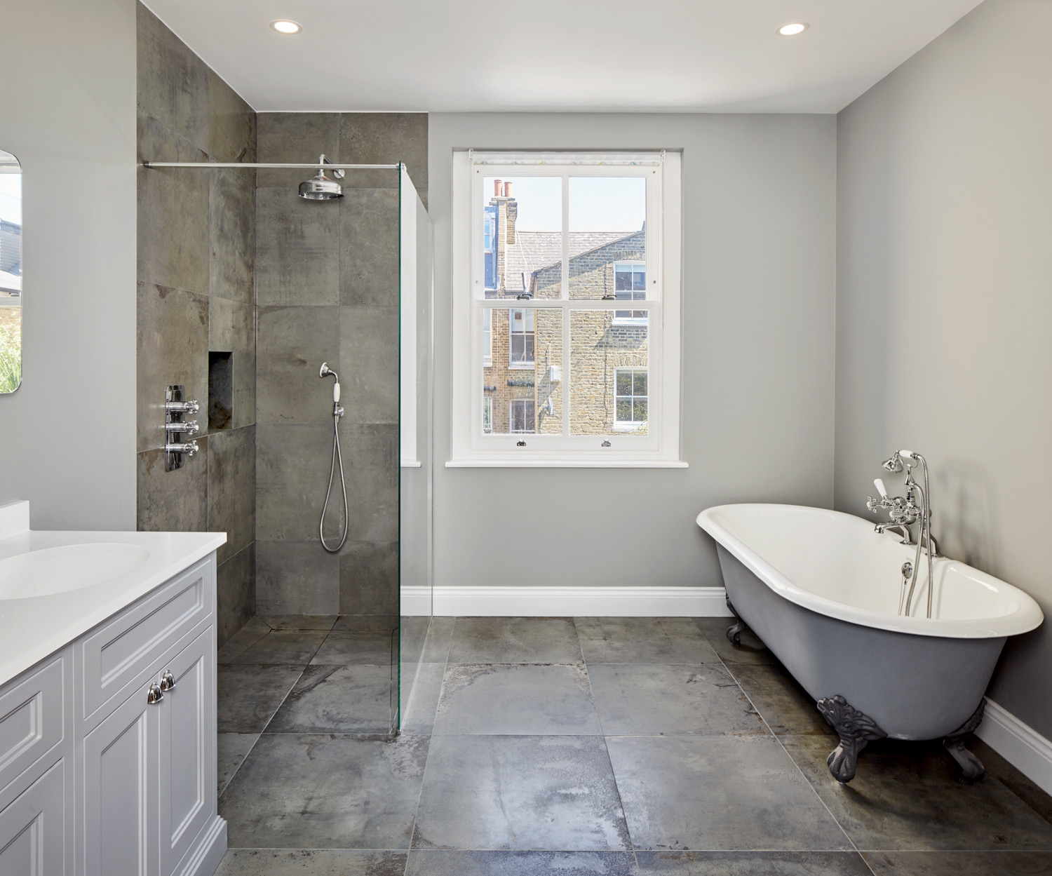 Bathroom with a roll-top bath and walk-in shower
