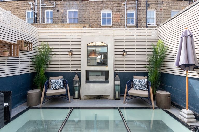 Courtyard with walk-on rooflights and an outdoor fireplace
