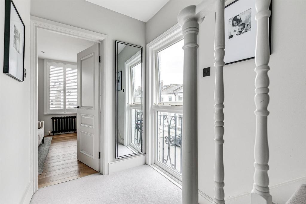 Landing with sash windows and painted balusters