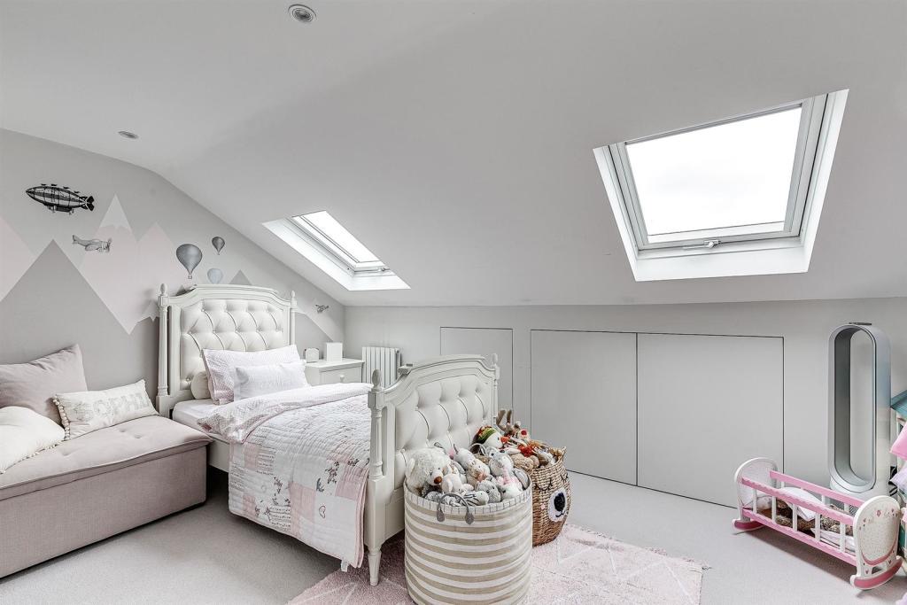 Loft bedroom with rooflights and eaves storage