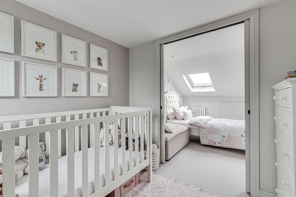 Loft nursery opening to a second bedroom