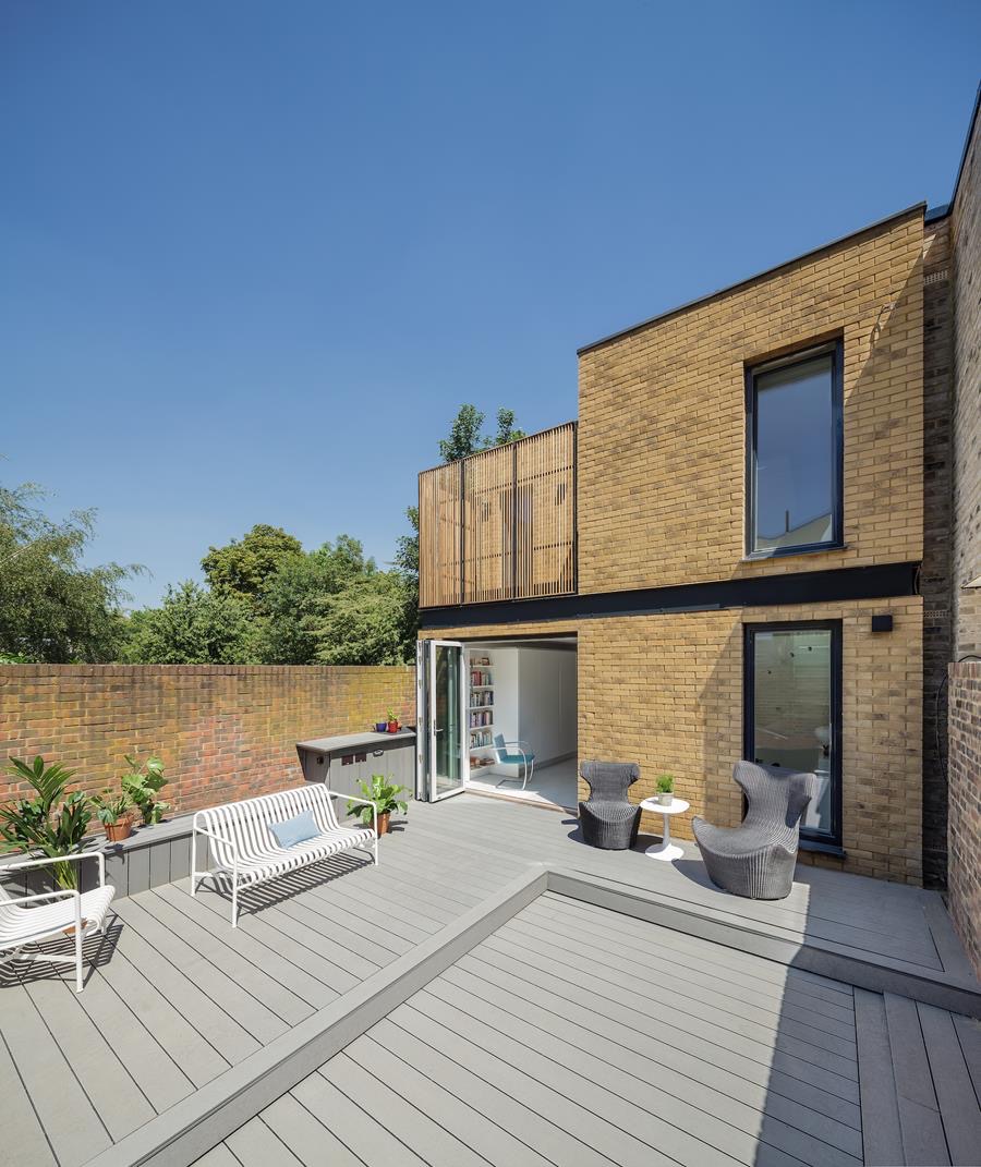 Rear terrace of a new-build brick house