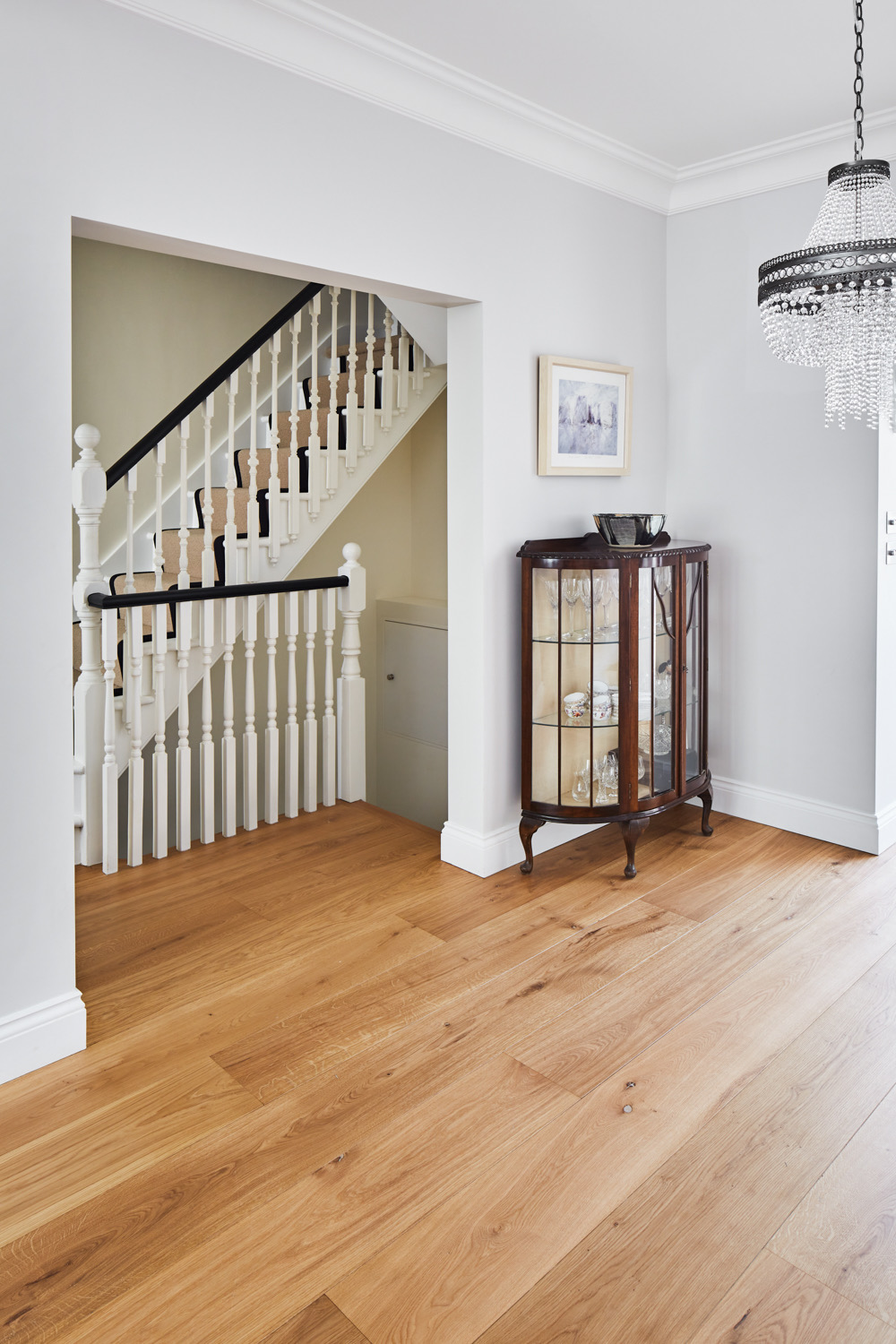 Restored staircase and wide-plank oak floor