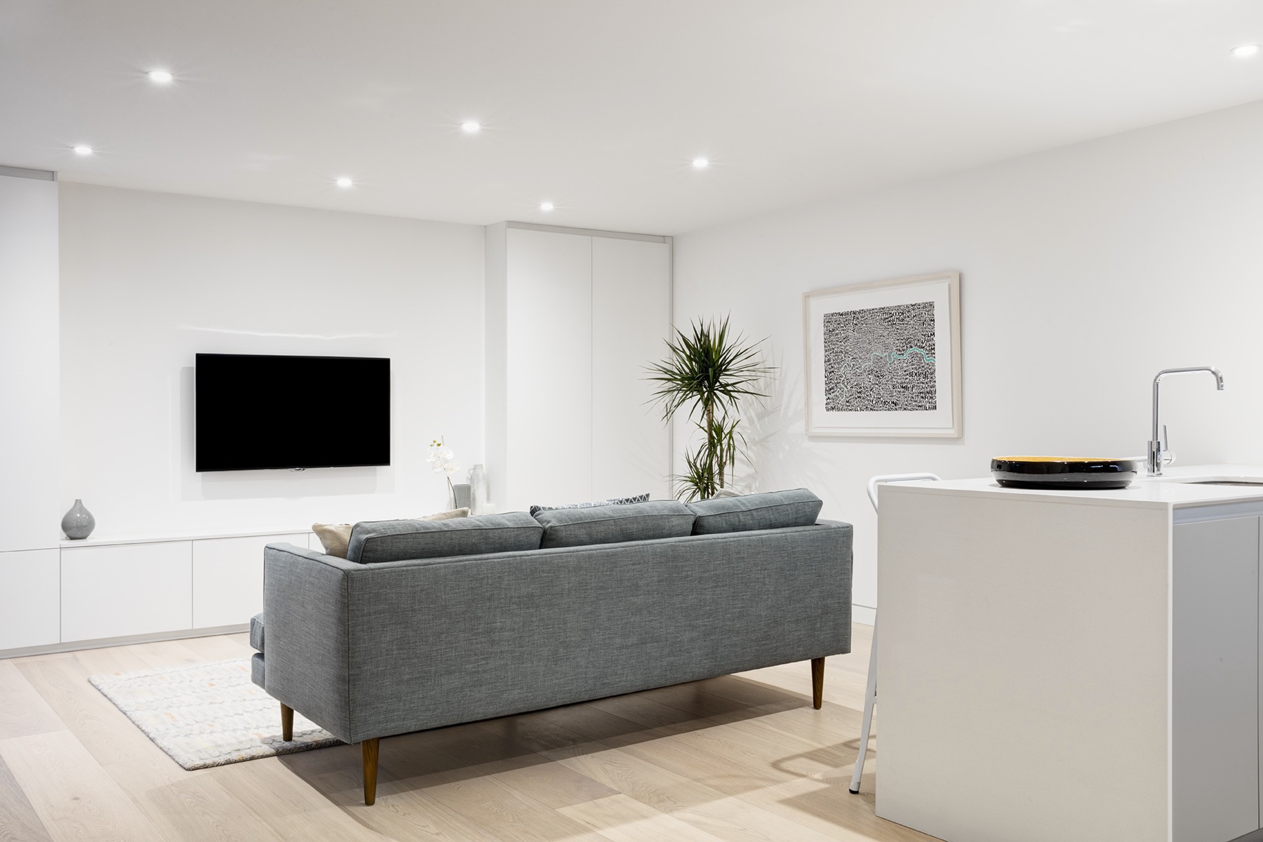 Open-plan living space with fitted storage, design and build in Barking and Dagenham