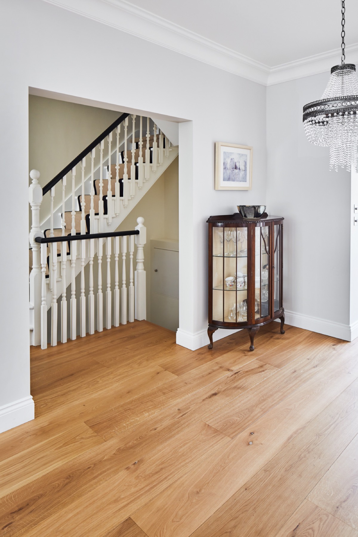 Restored staircase and wide-plank oak floor, design and build in Loughton