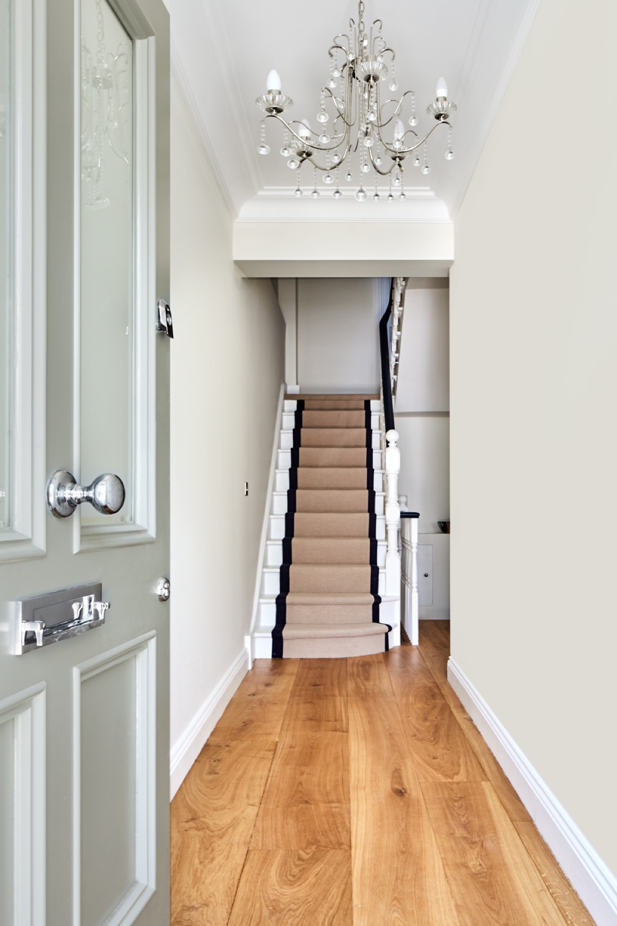 Entrance hall with stair runner and oak floor, design and build in Upminster