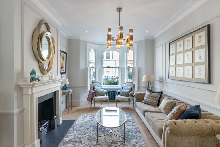 Drawing room with bay window and brass chandelier, design and build in Woodford