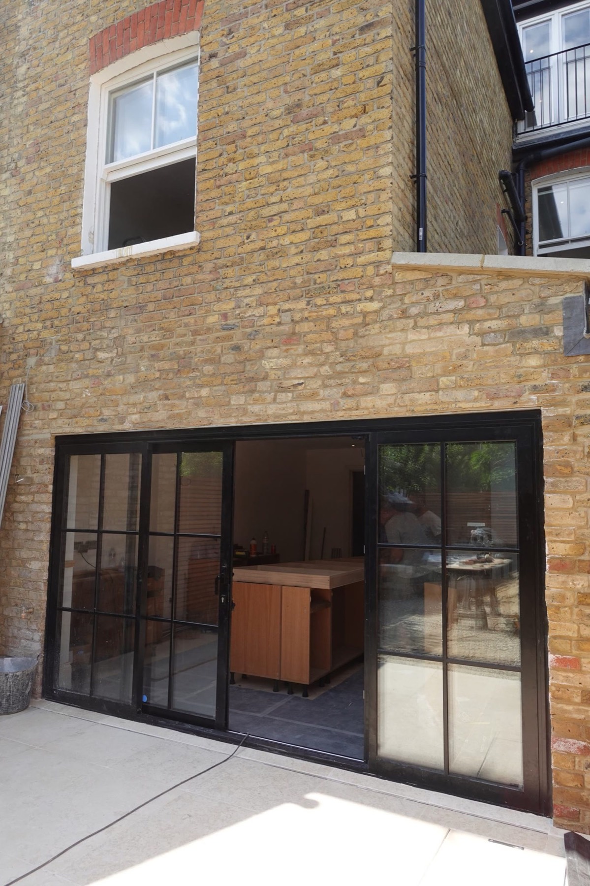 Brick rear extension with steel-framed doors in Walthamstow