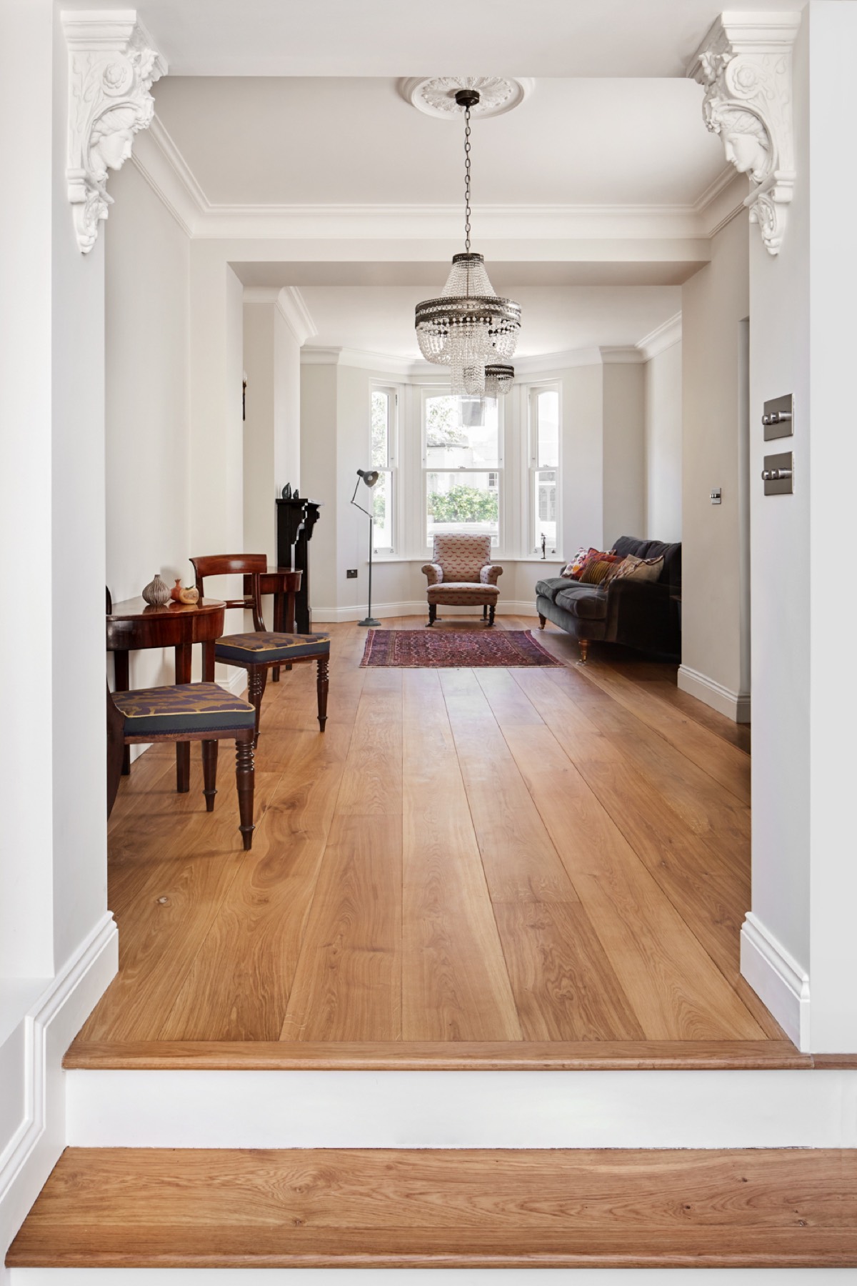 Reception room with bay window and restored cornicing, house renovation in Hackney