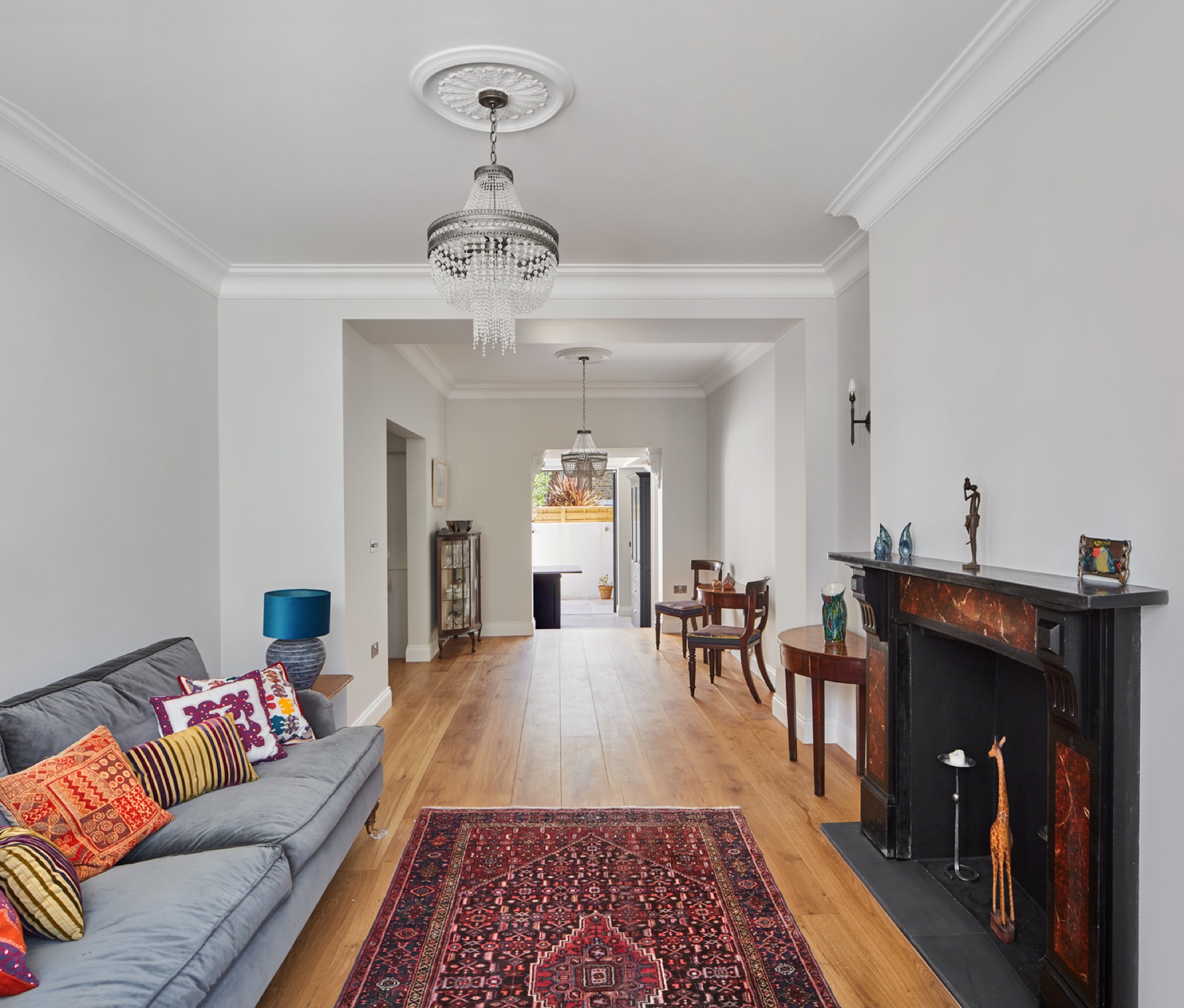 Through reception room with oak floor and period fireplace, house renovation in Upminster