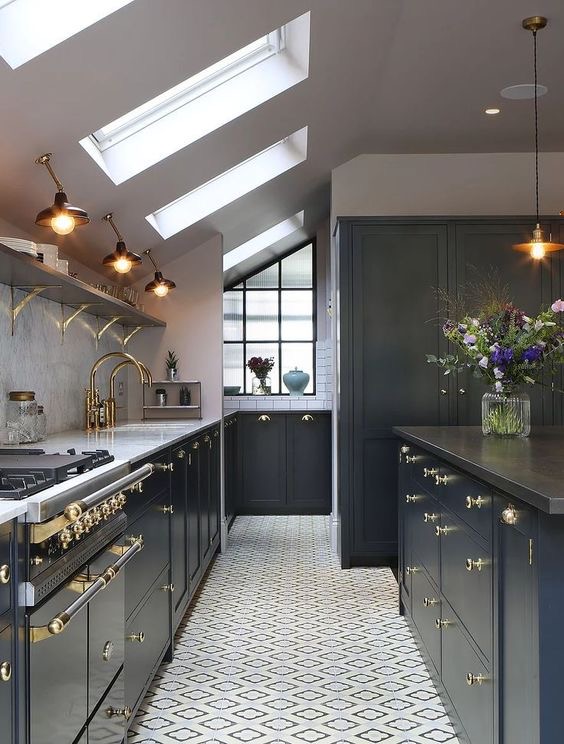 Dark shaker kitchen with brass fittings, rooflights and patterned floor tiles