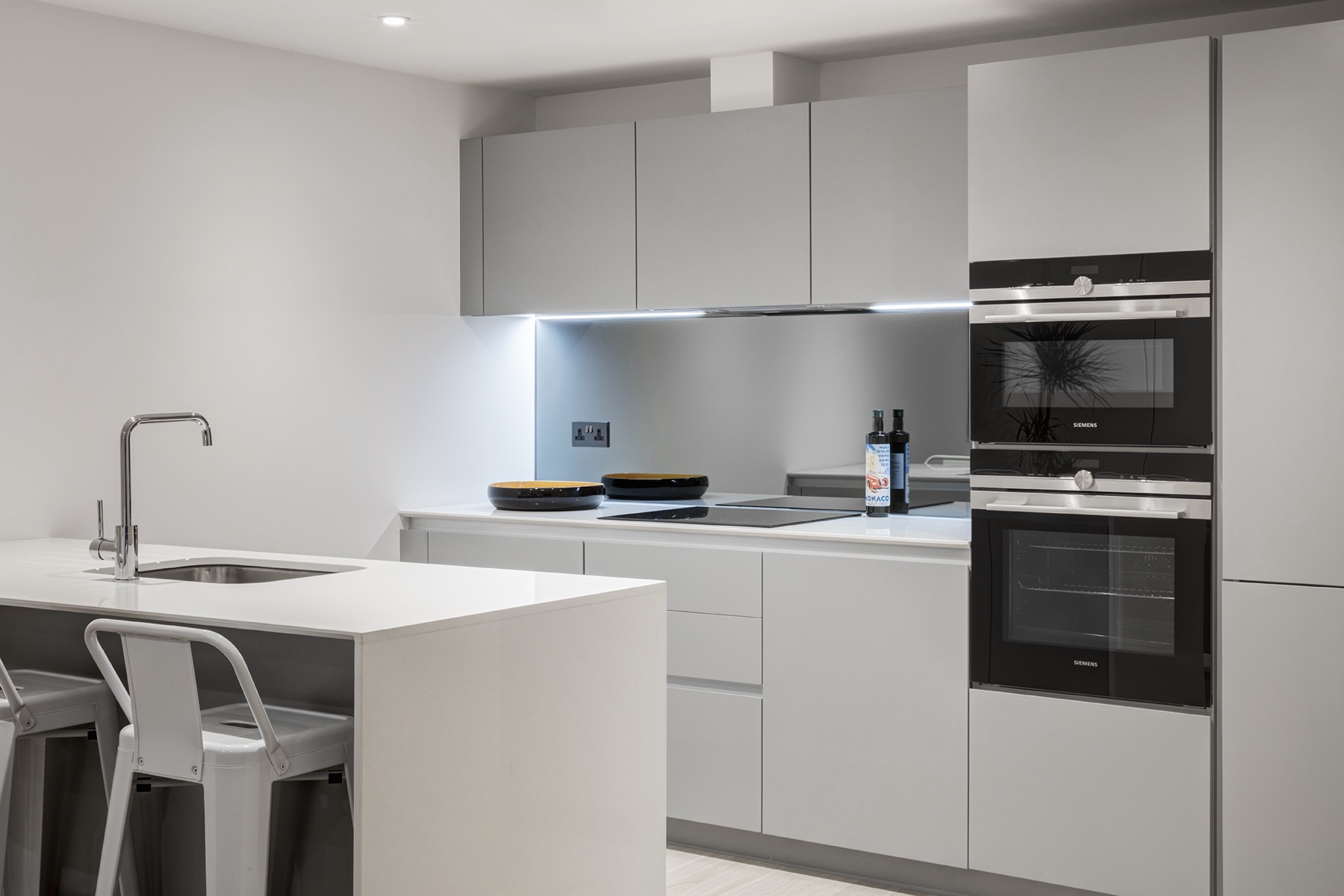 Handleless grey kitchen with integrated ovens, kitchen extension in Forest Gate and Newham