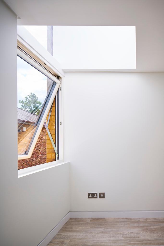 Room with a rooflight and top-hung window, loft conversion in Barking and Dagenham