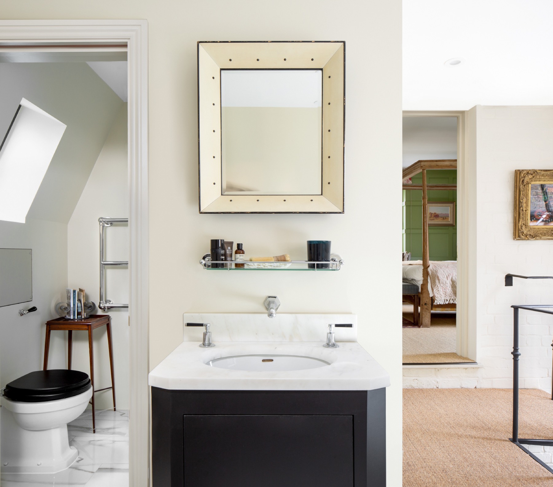 Bathroom vanity with a marble top and nickel taps, loft conversion in Epping