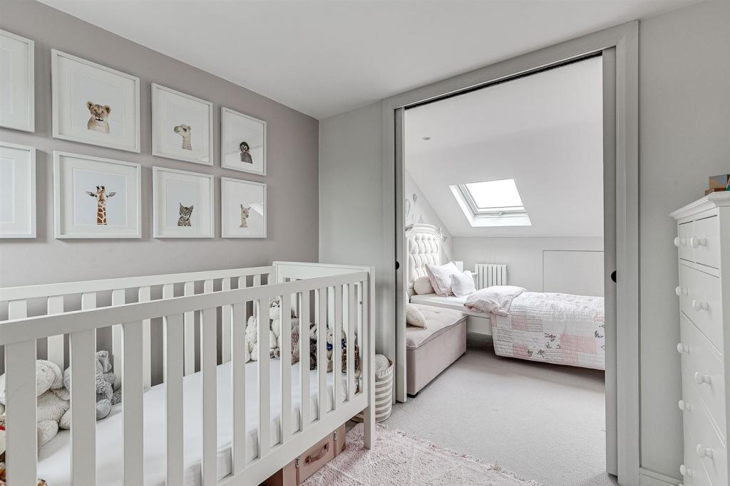 Loft nursery opening to a second bedroom, loft conversion in Wanstead